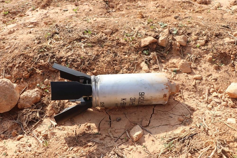 An unexploded 9N235 fragmentation submunition delivered by cluster munition rockets near  Wadi Khaled camp 2 kilometers west of Idlib city, northwestern Syria, on November 6, 2022.