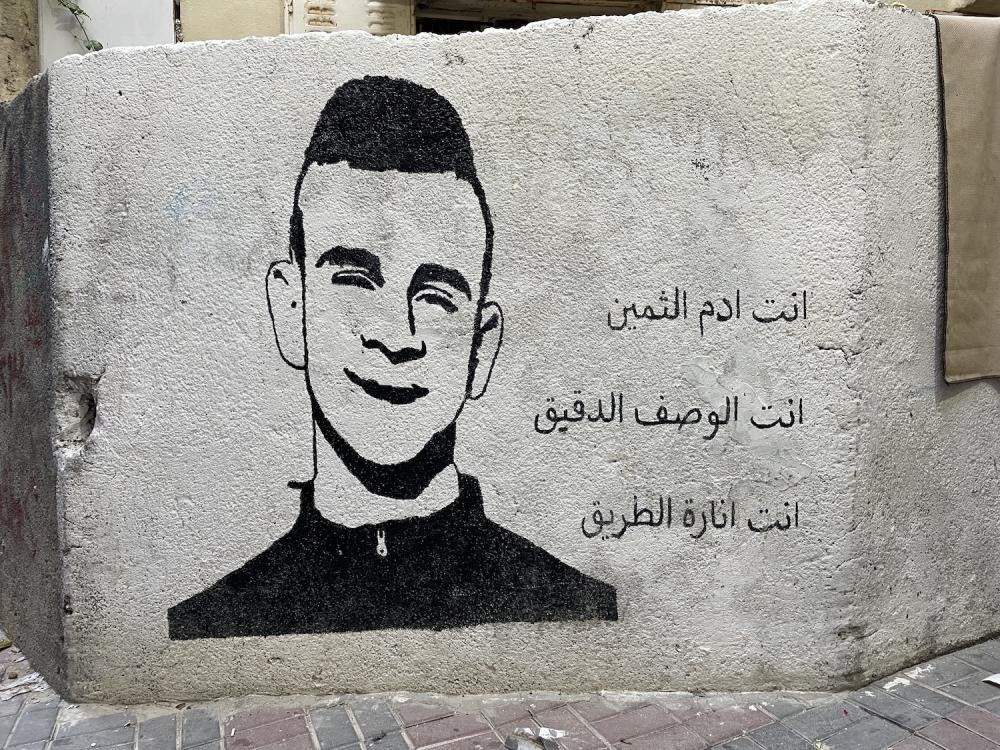 Un graffiti représentant Adam Ayyad, vu sur un petit mur dans le camp de réfugiés de Deheisheh. Photographie prise le 5 mai 2023. 