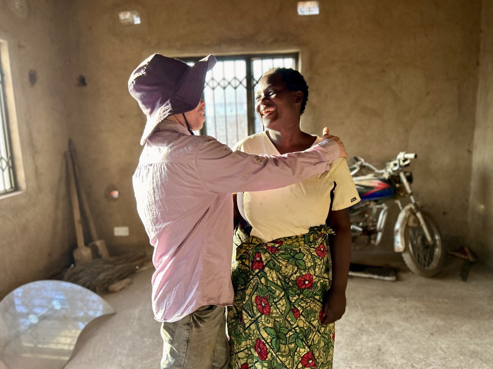 Idrisa Yusugu and Margret Ganizani inside the unfinished home they temporarily live in with their three children, Malawi.