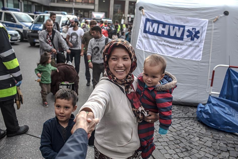 Refugees and asylum seekers arrive at the main train station in Munich, Germany on September 5, 2015. Many of them walked from Budapest towards Vienna the previous day. 