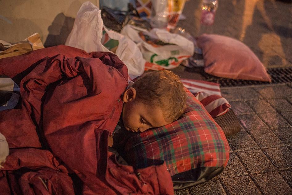 A boy sleeps at Hungary’s Keleti train station in Budapest where refugees and asylum seekers were waiting to be allowed to board trains to Germany. September 2, 2015.