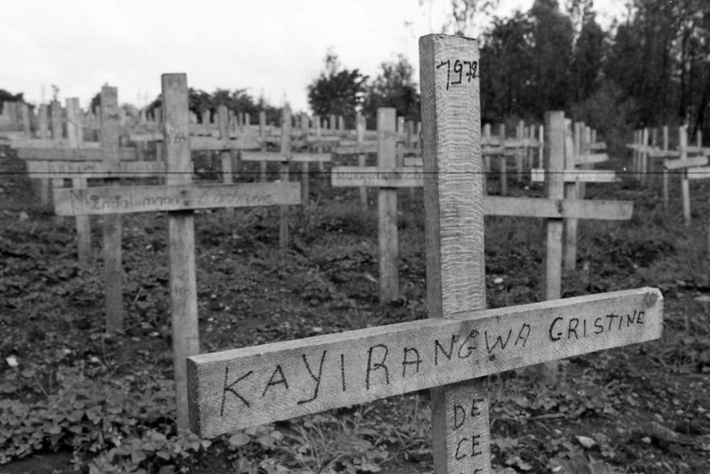 Crosses mark the mass grave of an estimated 600 civilians killed nearby during the genocide.
