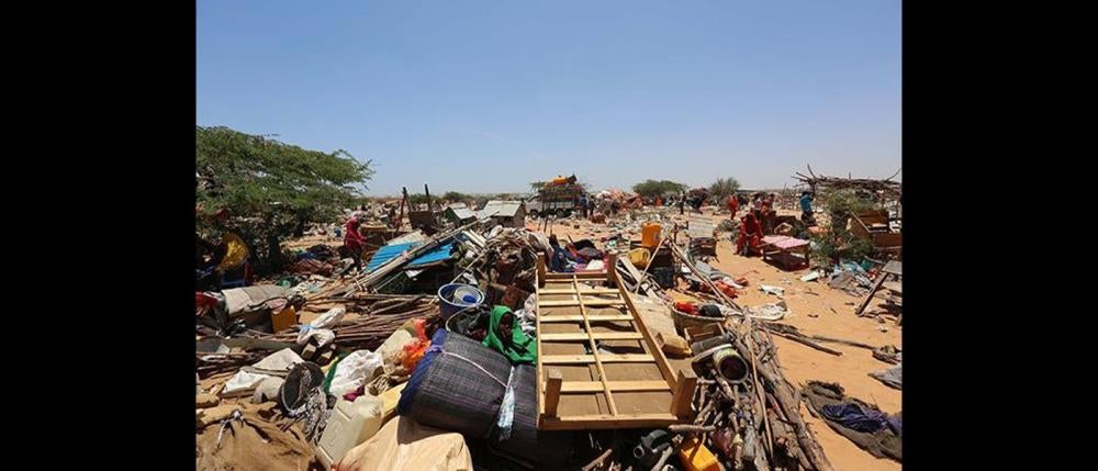 A child surrounded by her family’s belongings during the massive forced eviction by Somali authorities of a displaced person’s camp in the Kadha (formerly Dharkenley) district of Mogadishu, Somalia on March 4, 2015.