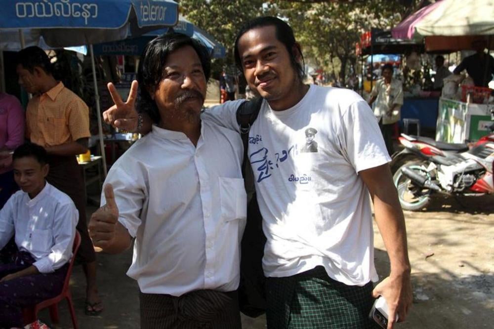 Activist Soe Zaw (right) stands in front of Rangoon’s Insein prison after his release on January 22, 2016, with fellow former political prisoner Wai Lu.