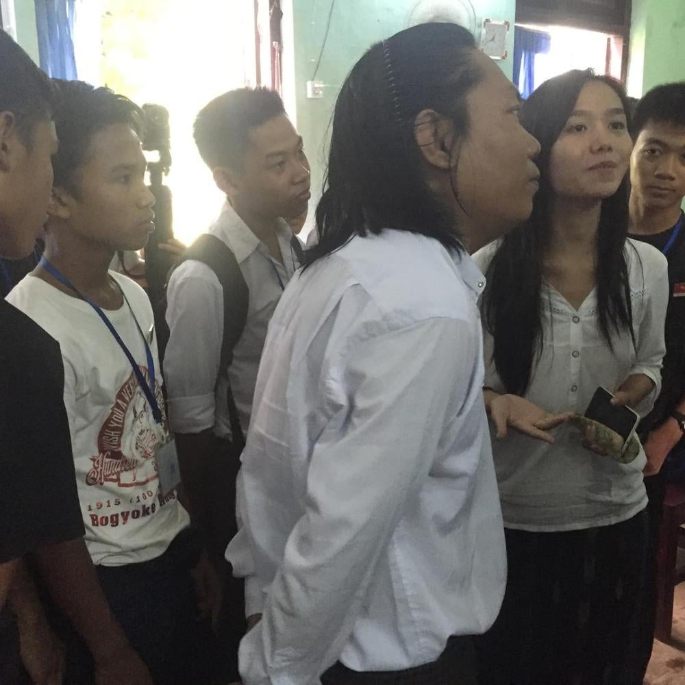 Detained student activist Phyo Phyo Aung speaks with supporters during a court appearance on October 27, 2015. 