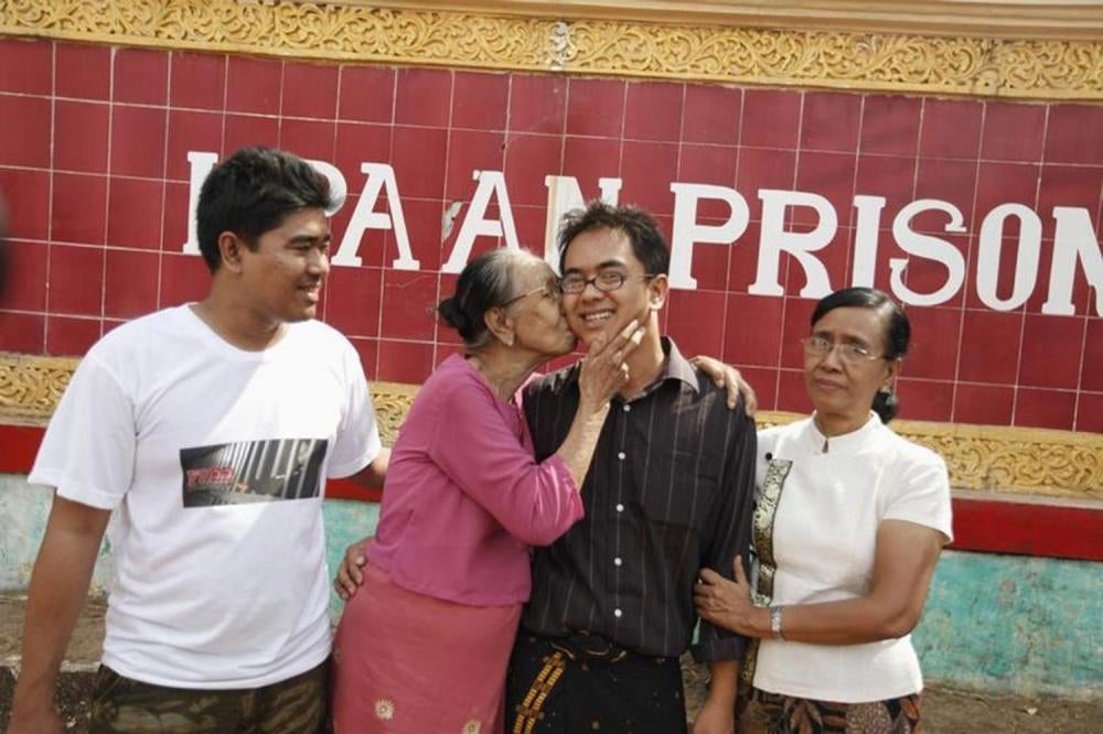 Burmese blogger Nay Phone Latt reunites with his brother, grandmother, and mother in front of Hpa-an prison on January 13, 2012, after being freed with about 200 other political prisoners in a government amnesty. 