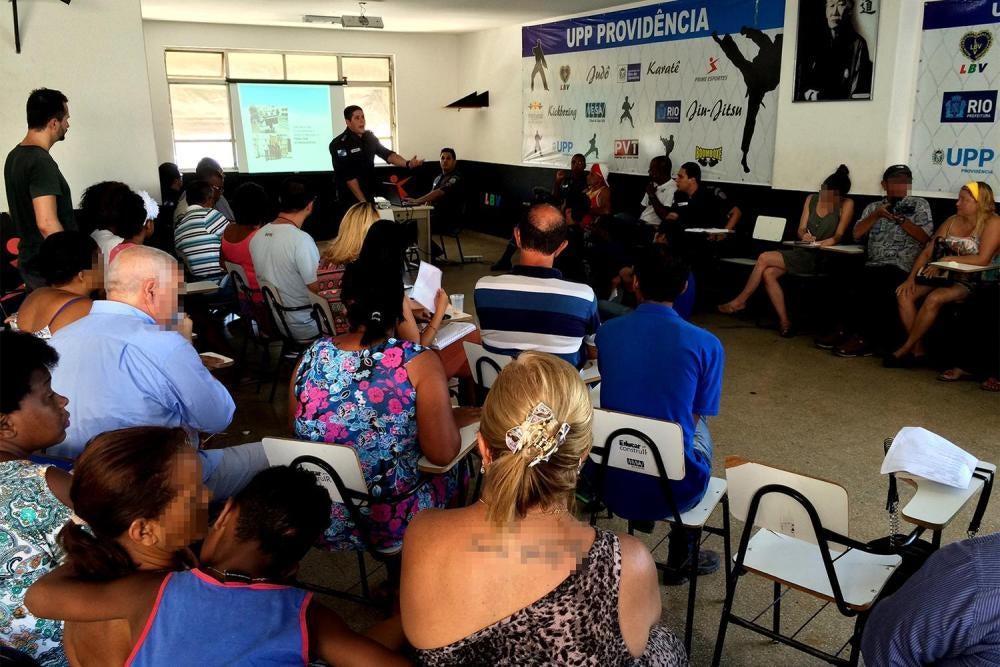 Military police Major Roberto Valente, commander of the Pacifying Police Unit (UPP) at the Morro da Providência favela, holds a meeting with the local community on December 15, 2015 to inform residents of the activities of the police in 2015 and hear thei