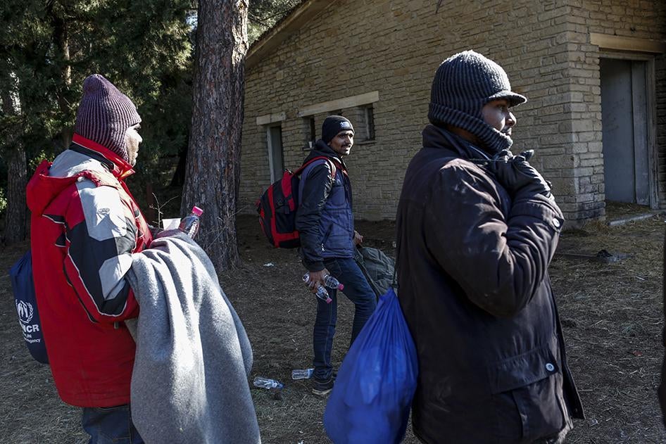 Sri Lankan and Bangladeshi migrants obtain food and water from a volunteer food kitchen near the Greek border with Macedonia. January 25, 2016.