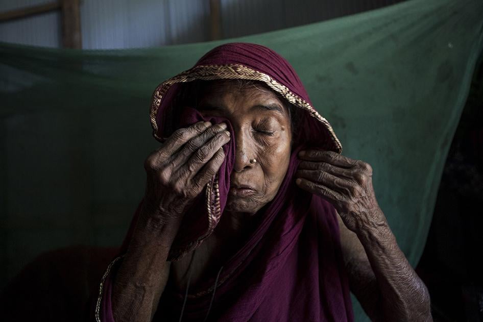 Anuwara Begum, in her 60s, cries while remembering her son-in-law, a farmer who died from arsenic-related illnesses. She herself has arsenic-related health conditions, but has never seen a doctor. Iruain village of Laksam Upazila in Comilla district, Bang