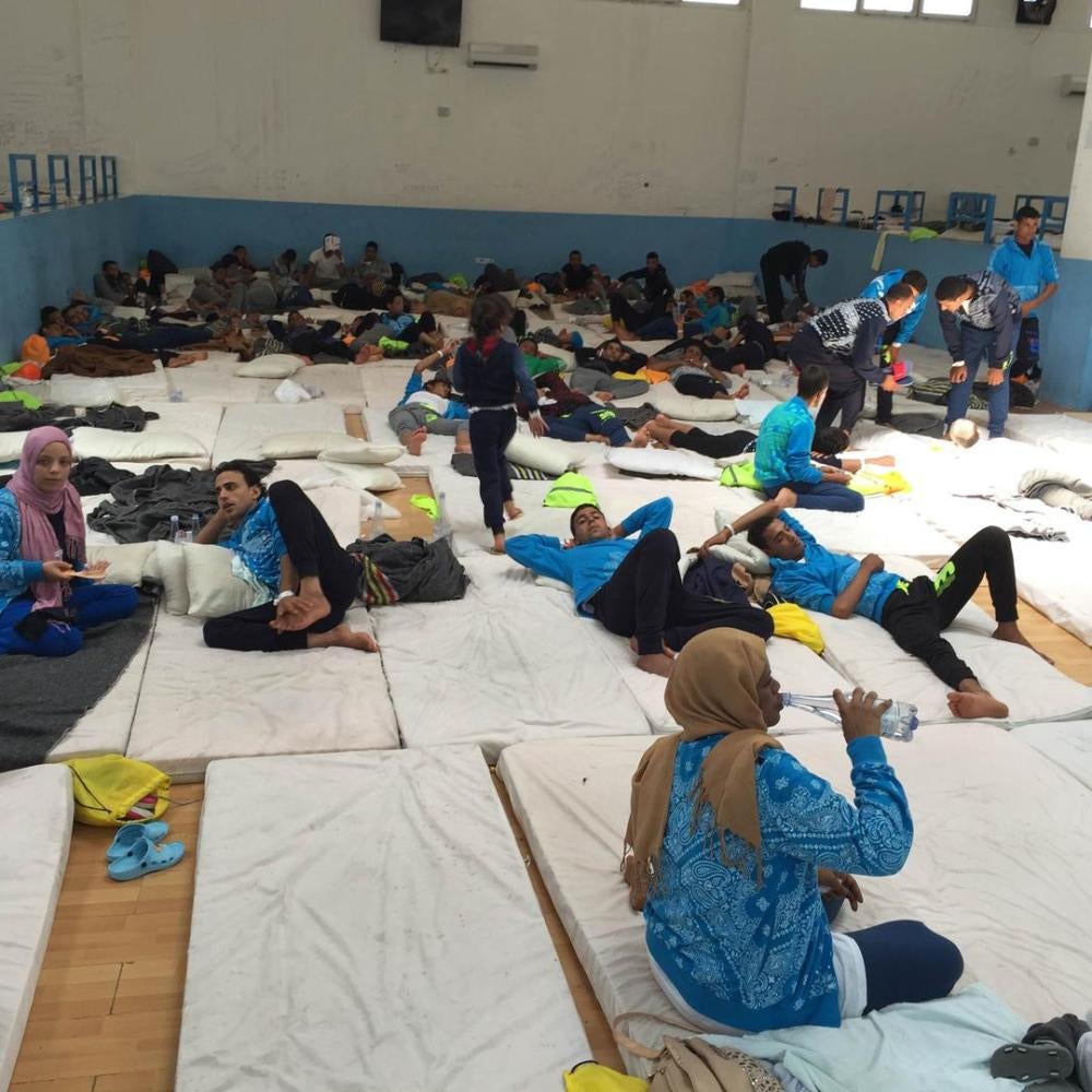 Migrants and asylum seekers, including families and unaccompanied children, in the main room at the Pozzallo “hotspot” in Sicily, Italy on June 9, 2016. The center with capacity of 180 was holding 365 people.