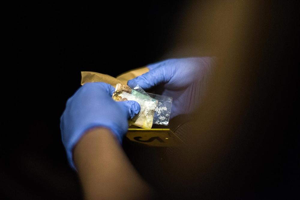 A small sachet of shabu, a form of methamphetamine, is found wrapped in a 500 peso bill found in Jayson Reuyan's pocket after he was killed in Five masked armed men broke into a house in Bulacan an alleged drug buy-bust operation by the police.