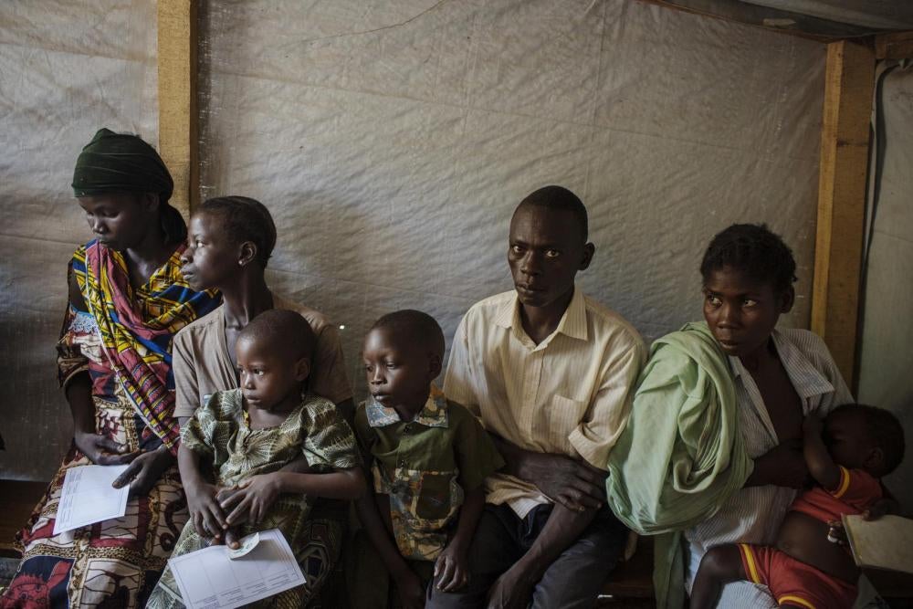 Displaced people waiting at a medical clinic in the main camp in Batangafo, Ouham province, August 2015. 