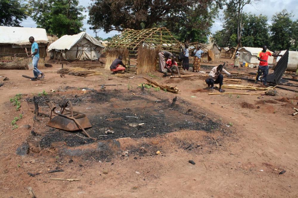Men rebuilding homes in the Batangafo displacement camp, Central African Republic, after the July 29 attack by MPC fighters. 