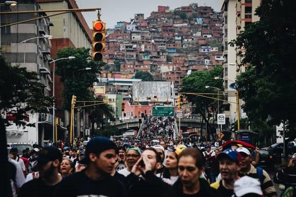 Opposition activists march in a popular neighborhood of Caracas, Venezuela, during an anti-government demonstration. April 13, 2017. 