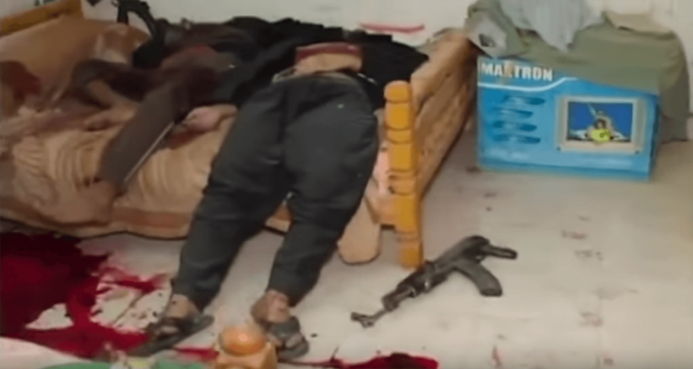 Still from a video published by the Egyptian Interior Ministry. Military experts said the position of the bodies, blood, and guns in this scene from the Interior Ministry’s video indicated that the commandos may have moved the men’s bodies before filming 