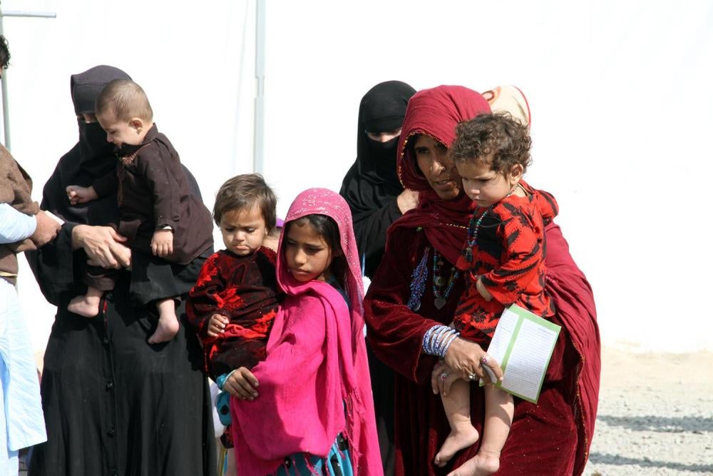 Afghan refugee women and their children arrive at the UN refugee agency’s support center outside Kabul after being forced out of Pakistan in October 2016. Pakistan’s threats and abuses drove out about 360,000 registered refugees and a further 200,000 undo