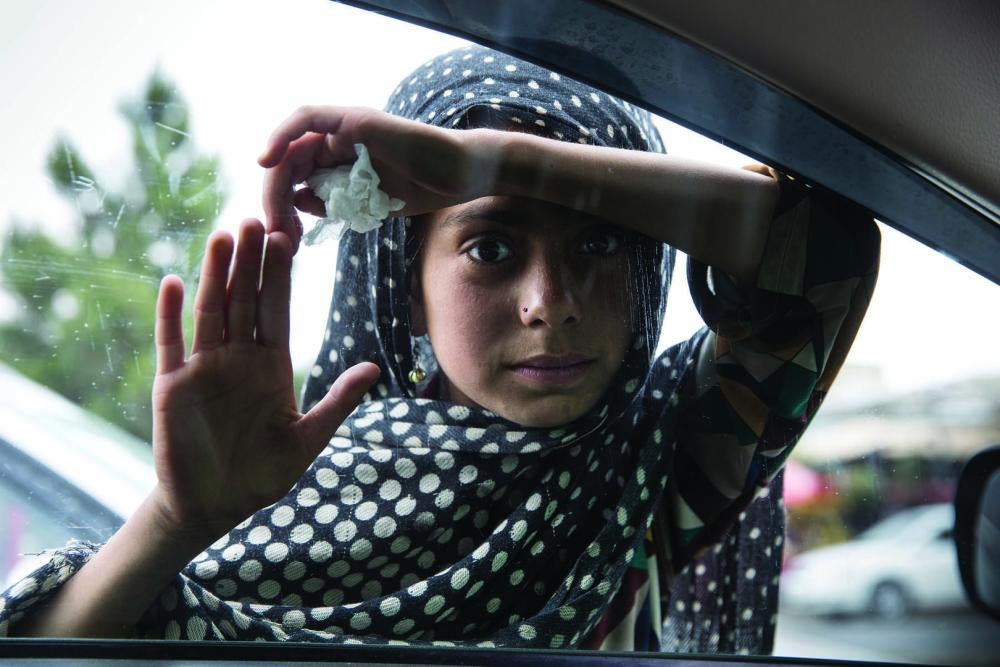 A girl begs on the streets of Kabul, Afghanistan. 