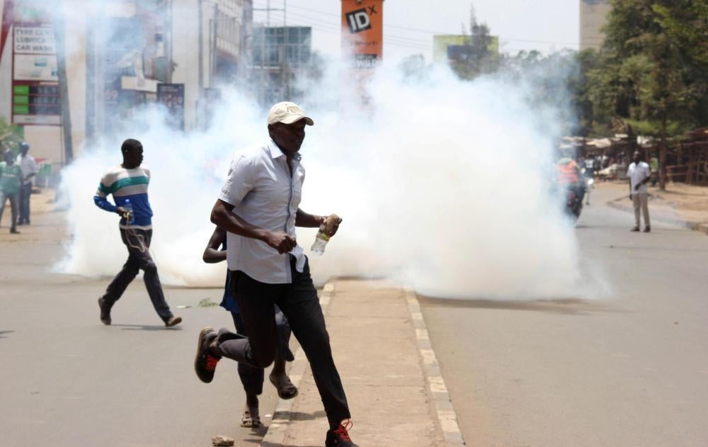 Riot police fire teargas canisters to disperse supporters of Kenyan opposition leader Raila Odinga of the National Super Alliance (NASA) coalition protesting against the treason charges on lawyer Miguna Miguna in the streets of Kisumu, Kenya.