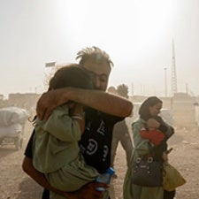 Figures carry bags and children. 