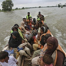 People make their way through flooding in Pakistan. 