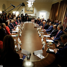 Political leaders meet at circular table. 