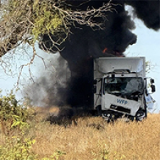 Aid truck in flames. 