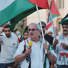 Protesters hold Palestinian flags. 