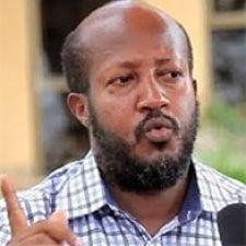 Kizito Mihigo faces camera. 