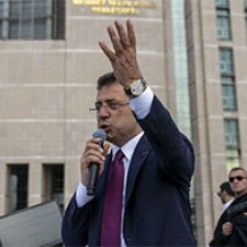 Opposition leader addresses crowd. 