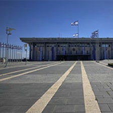 One story building holds flag of Israel. 