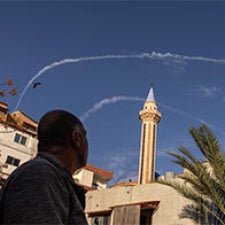 Figure looks at sky with chem trails.