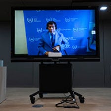 Figure is displayed on television. 