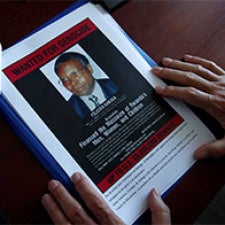 Two hands framing memorial image. 