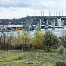 A bridge destroyed, laying in the river