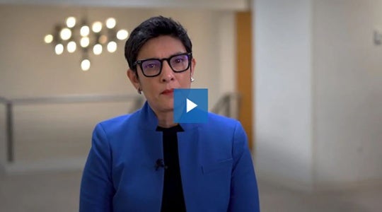 Screenshot from a video showing a woman speaking