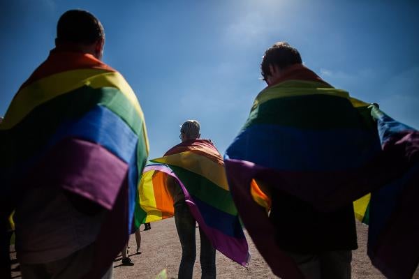 Activists participate in the St Petersburg LGBT Pride march on August 12, 2017.