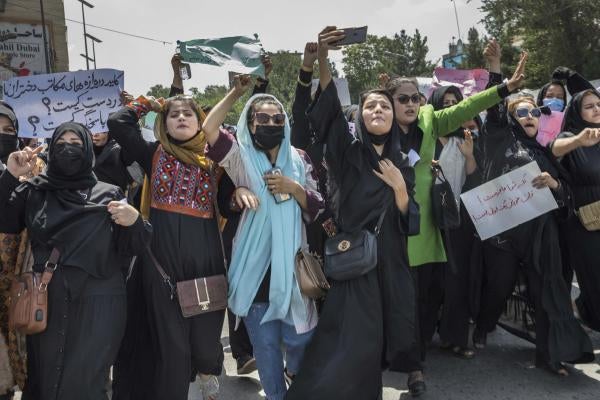 Afghan women demonstrate against violations of their rights in the center of Kabul, Afghanistan, August 13, 2022. 