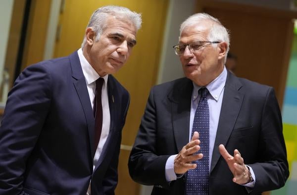 Yair Lapid, then Israeli foreign minister and current prime minister, speaks with the EU’s High Representative for Foreign Affairs and Security Policy Josep Borell during a July 2021 meeting of EU foreign ministers in Brussels.