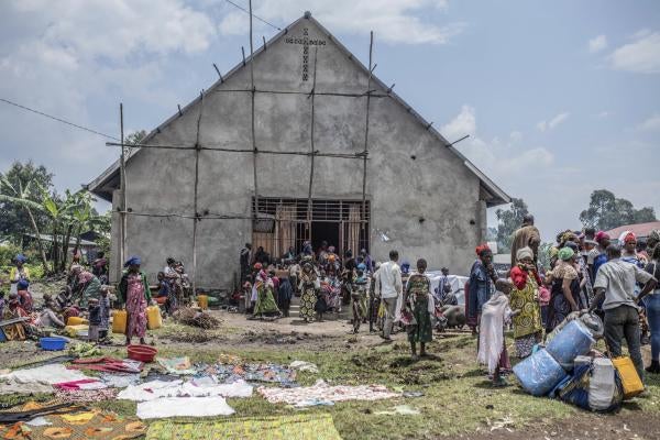 Civilians flee fighting between M23 rebels near Kivu.