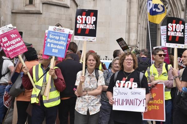Protesters gathered opposite The Royal Courts Of Justice over UK's agreement with Rwanda. 