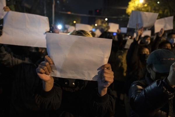 Protesters hold up white pieces of paper during a demonstration in Beijing against China’s “zero Covid-19" measures.