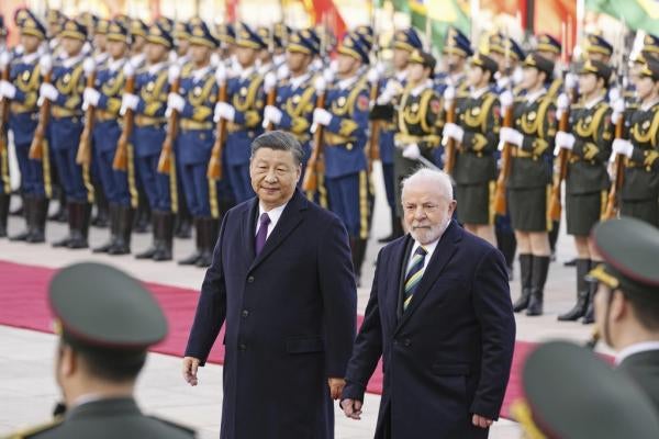 Brazilian President Luiz Inacio Lula da Silva (R), along with Chinese President Xi Jinping, attends a welcome ceremony at the Great Hall of the People in Beijing on April 14, 2023.