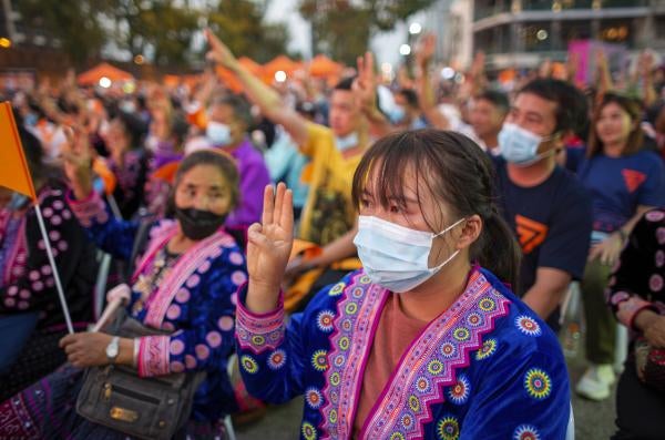Ethnic minority women make three-finger salutes during pro-democracy demonstration in Chiang Mai, Thailand.