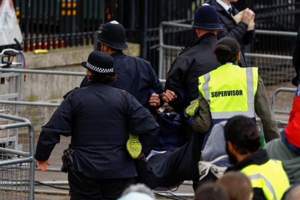 Police detain a protester on the day of Britain's King Charles and Queen Camilla's coronation ceremony, in London, Britain May 6, 2023