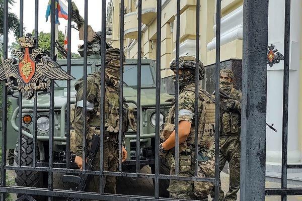 Servicemen of the Wagner Group military company guard an area at the headquarters of the Southern Military District in Rostov-on-Don, Russia, Saturday, June 24, 2023. (AP Photo)