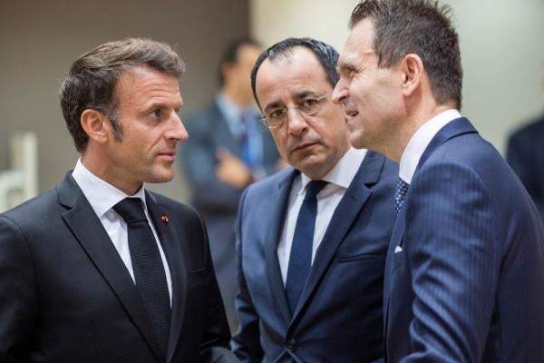 France's President Emmanuel Macron, left, speaks with Cypriot President Nikos Christodoulides, second right, and Slovakia's Prime Minister Ludovit Odor during a round table meeting at an EU summit in Brussels, Thursday, June 29, 2023.
