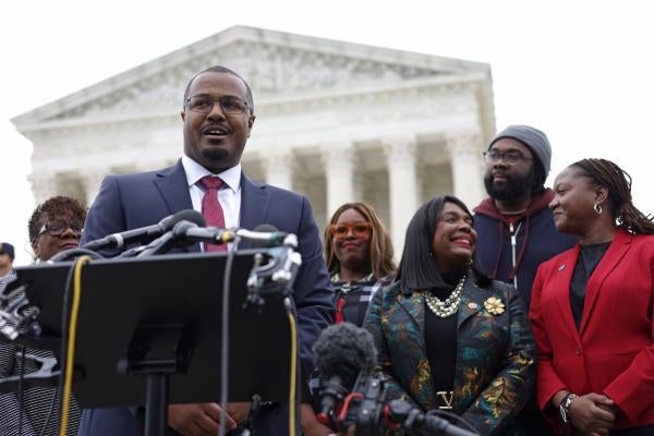 Lead counsel for the plaintiffs Deuel Ross (2nd left) speaks to members of the press as President and Director-Counsel of the NAACP Legal Defense Fund Janai Nelson (right), plaintiff Evan Milligan (2nd right), U.S. Rep. Terri Sewell (D-AL) (3rd right), and Khadidah Stone, plaintiff (4th right) listen after the oral argument of the Allen v. Milligan case at the U.S. Supreme Court in Washington, DC, US, October 4, 2022.