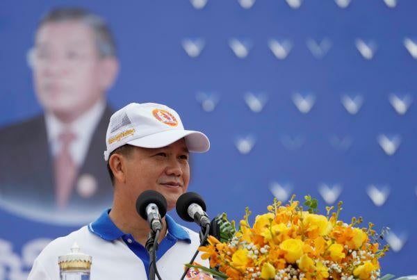 Hun Manet, front right, a son of Cambodia Prime Minister Hun Sen, delivers a speech before leading a procession to mark the end of an election campaign of Cambodian People's Party, in Phnom Penh, Cambodia, Friday, July 21, 2023. © AP Photo/Heng Sinith 