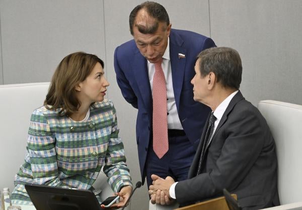At a plenary session of Russia’s State Duma, First Deputy Chairman of the Russian State Duma Committee on State Building and Legislation Irina Pankina (left), confers with Chairman of the Russian State Duma Committee on Economic Policy Maxim Topilin (center) and First Deputy Chairman of the Russian State Duma Alexander Zhukov, Moscow, July 14, 2023. 