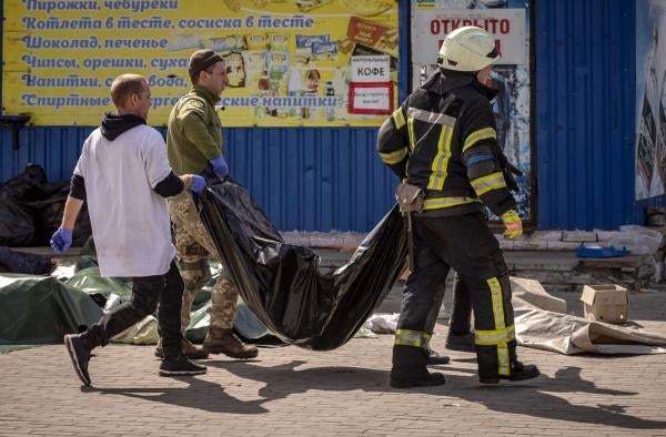 Bodies being removed after Russia's cluster munitions attack on a train station in Kramatorsk, Ukraine, on April 8, 2022. 